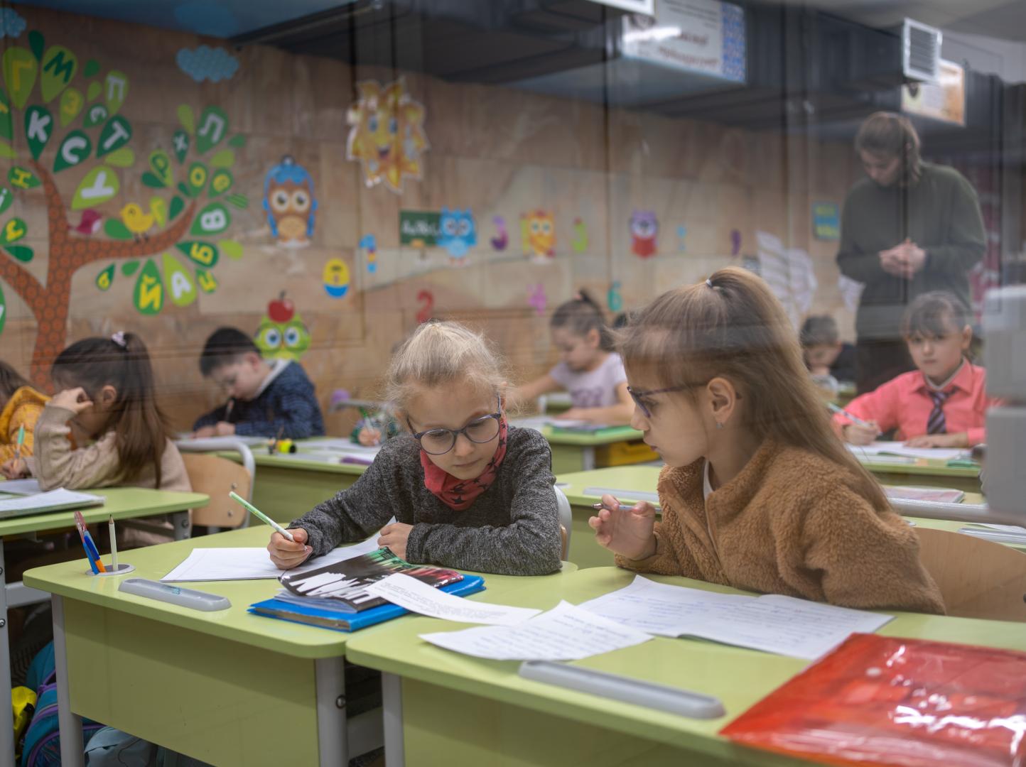 children sitting at the class tables