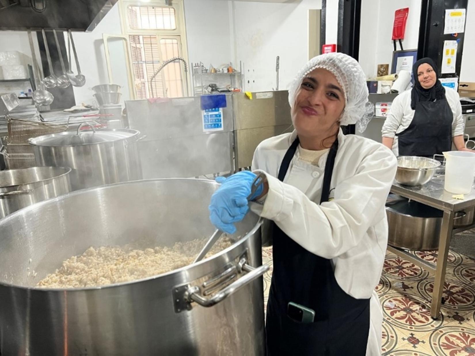 Samira Yamout radiates positivity as she takes charge in the community kitchen, embodying hope and resilience for persons with disabilities.