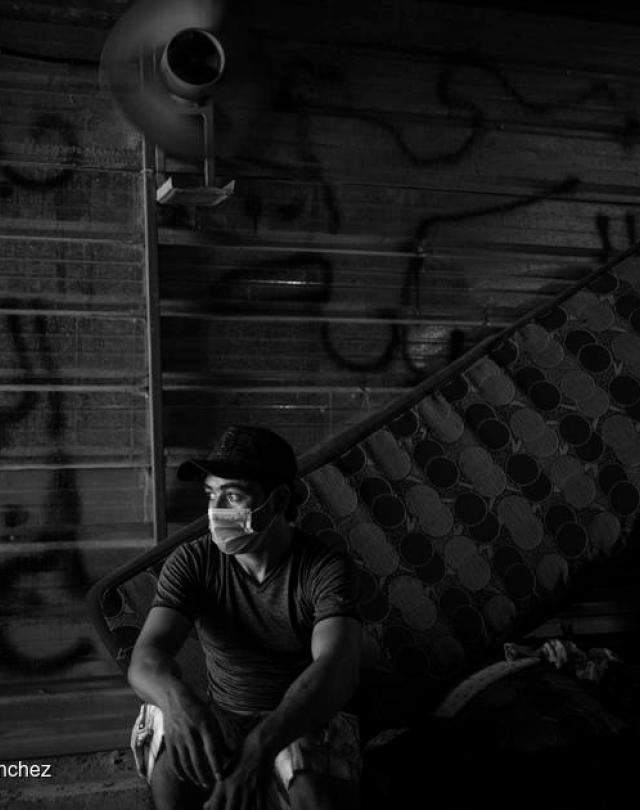 Syrian refugee sitting in his shelter in one of Lebanon's Syrian refugees camp, gazing into space.