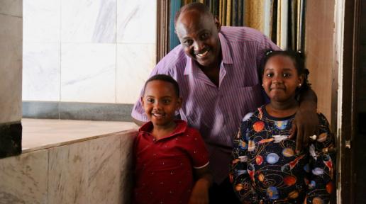 Ibrahim at home with his son and daughter